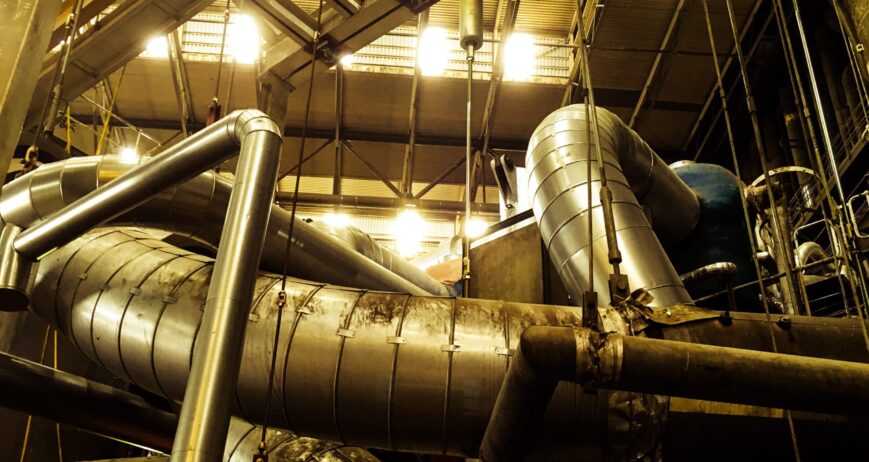 low-angle-view-pipelines-illuminated-factory